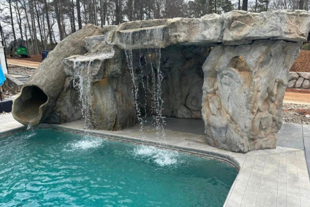 stone waterfall with waterslide